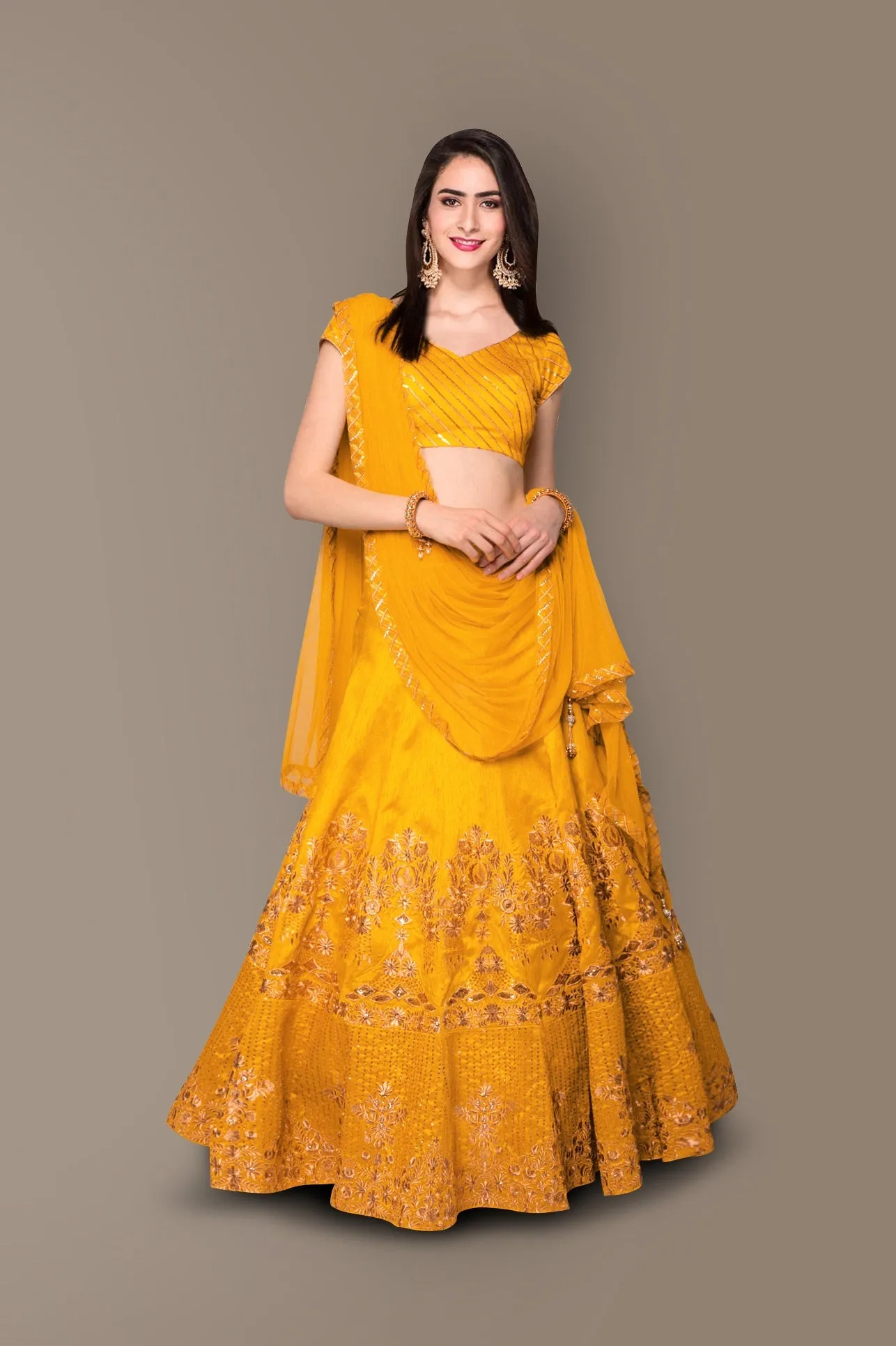 Sophisticated Yellow Colored Party wear Embroidered Lehenga Choli