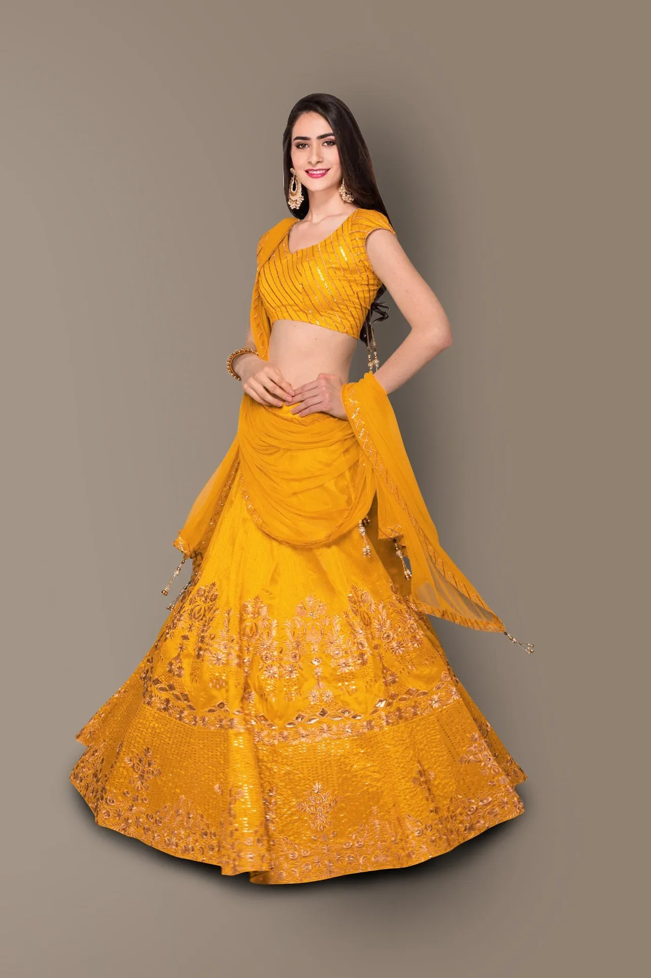 Sophisticated Yellow Colored Party wear Embroidered Lehenga Choli